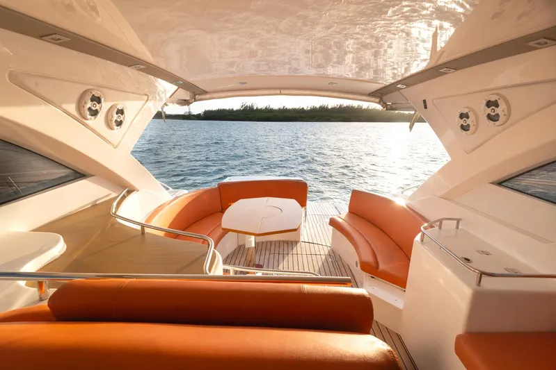  Yacht Photos Pics Luxurious 2018 Schaefer 400 Sport yacht interior with orange seating and ocean view.