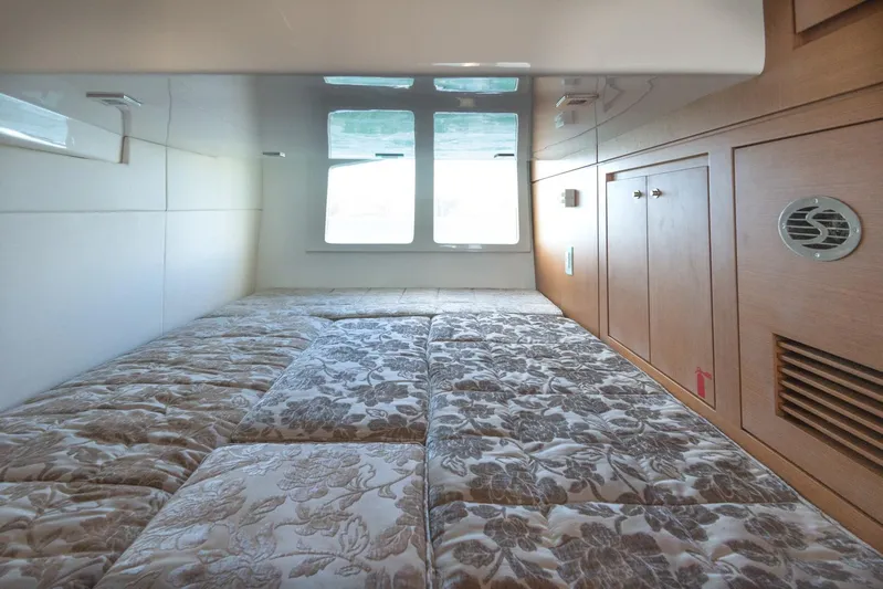  Yacht Photos Pics Interior cabin of 2018 Schaefer 400 Sport yacht with bed and storage cabinets.
