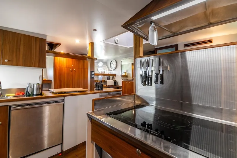 La Fenice Yacht Photos Pics Luxurious kitchen interior of 1962 Laurent Giles TSDMY Gentleman's Motor Yacht, featuring modern amenities.