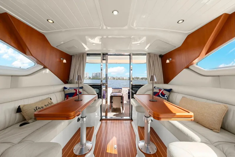 Lady Di Yacht Photos Pics Luxurious interior of 2007 Oyster LD43 yacht with elegant seating and wooden accents.