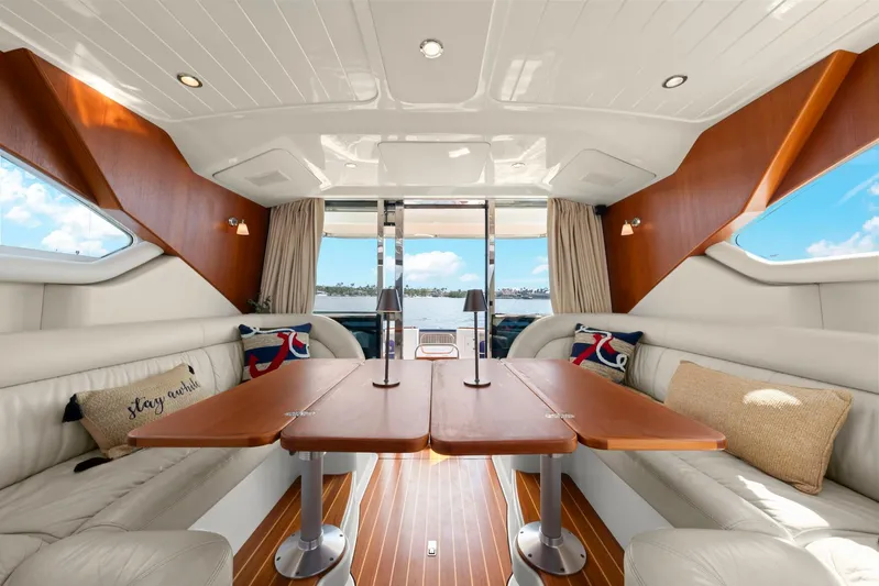 Lady Di Yacht Photos Pics Luxurious interior of 2007 Oyster LD43 yacht with elegant seating and wooden table.