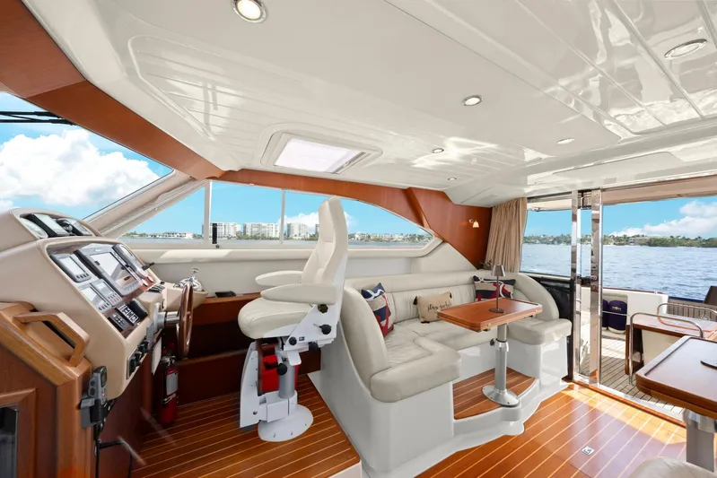 Lady Di Yacht Photos Pics Luxurious 2007 Oyster LD43 yacht interior with plush seating and modern helm.