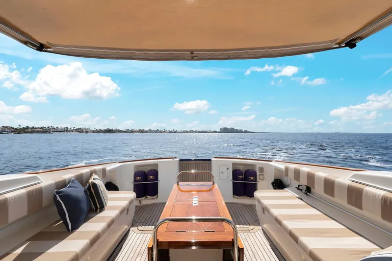 Lady Di Yacht Photos Pics 2007 Oyster LD43 yacht interior with ocean view, featuring comfortable seating and wooden table.