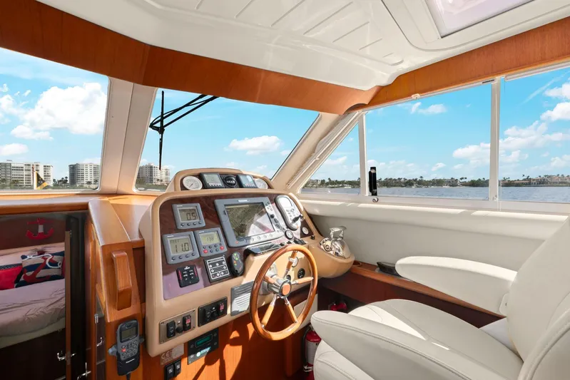 Lady Di Yacht Photos Pics Interior of 2007 Oyster LD43 yacht with modern navigation equipment and luxurious seating.