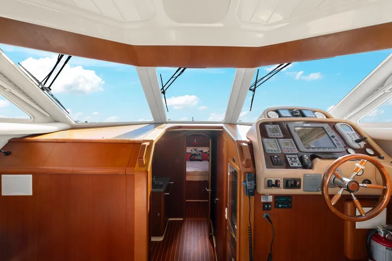 Lady Di Yacht Photos Pics 2007 Oyster LD43 yacht interior with wooden dashboard and navigation equipment.