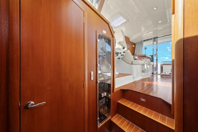 Lady Di Yacht Photos Pics Interior of 2007 Oyster LD43 yacht with wooden finishes and steps leading to deck.