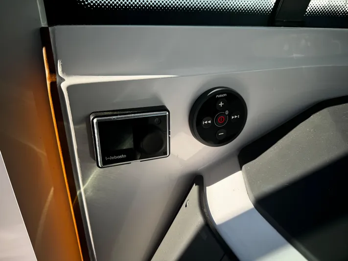 Lemaire Yacht Photos Pics Control panel of 2023 Axopar 28 CABIN boat, featuring modern navigation and audio controls.