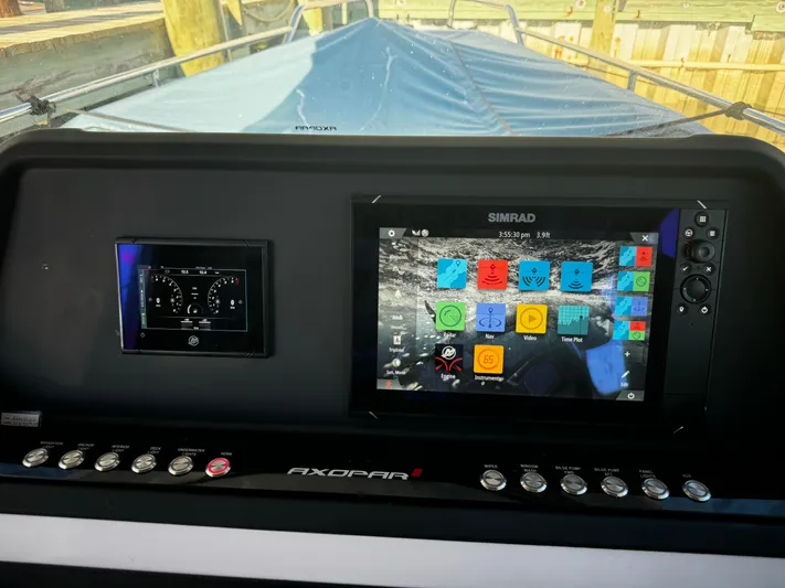 Lemaire Yacht Photos Pics 2023 Axopar 28 CABIN dashboard with Simrad navigation display.