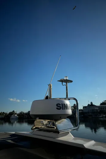 Lemaire Yacht Photos Pics 2023 Axopar 28 CABIN boat with radar system on calm water.