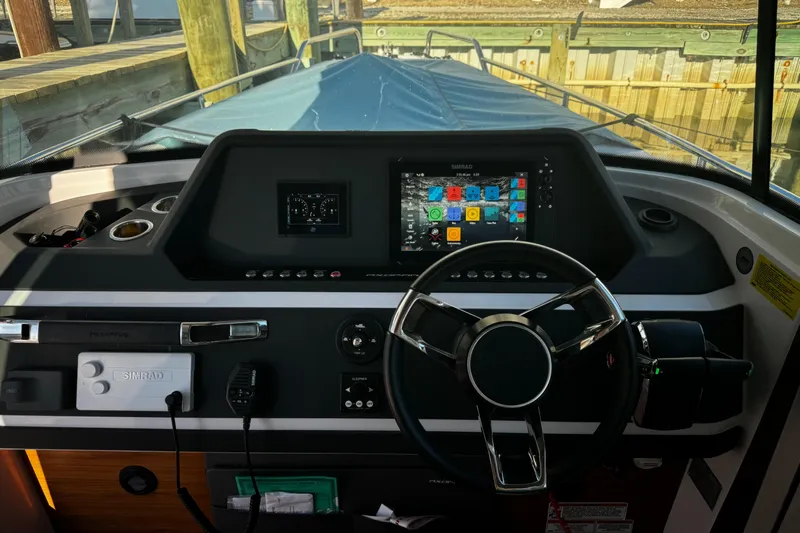 Lemaire Yacht Photos Pics 2023 Axopar 28 CABIN boat dashboard with modern navigation system.