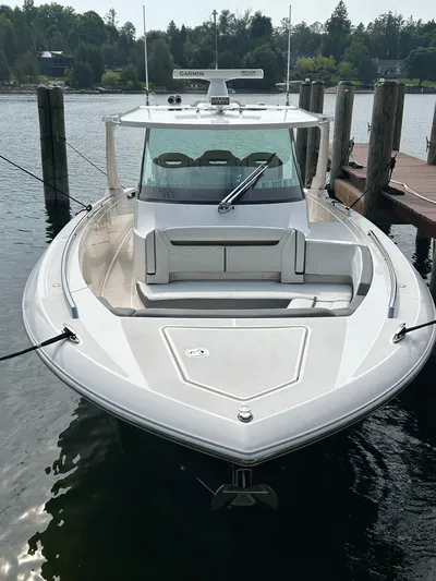  Yacht Photos Pics 2019 Tiara Yachts 38 LS docked, showcasing sleek design and spacious deck.