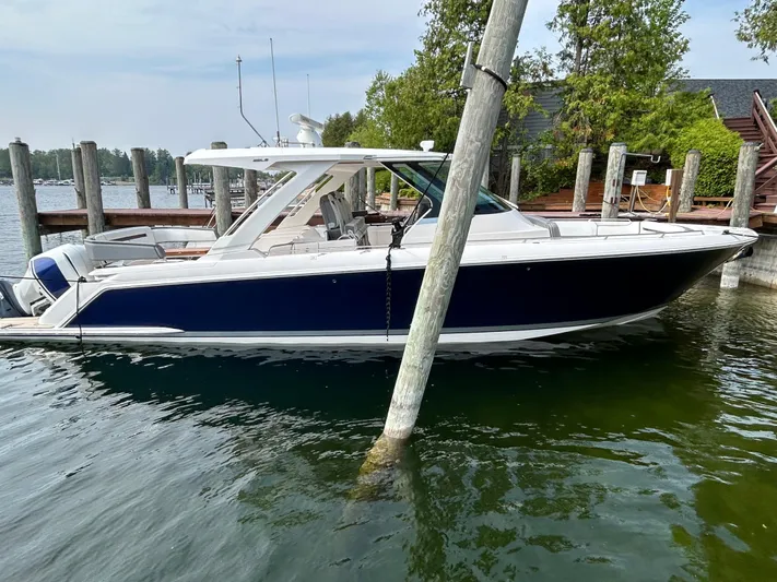  Yacht Photos Pics 2019 Tiara Yachts 38 LS docked in a marina, side view.