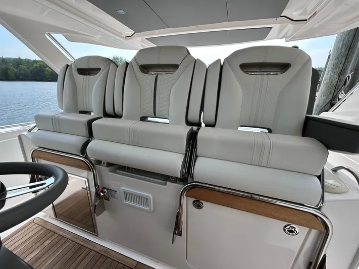  Yacht Photos Pics 2019 Tiara Yachts 38 LS interior seating with luxurious gray upholstery and sleek design.