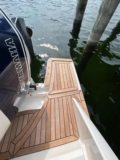 Yacht Photos Pics 2019 Tiara Yachts 38 LS with Yamaha engine, docked by wooden posts.