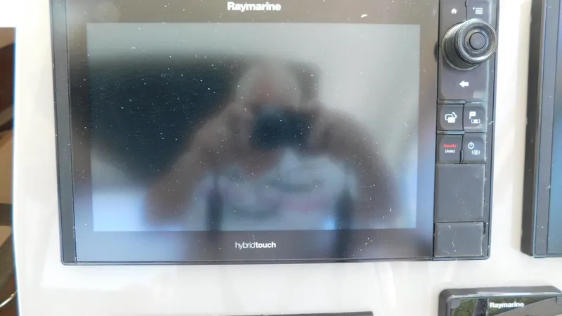  Yacht Photos Pics Raymarine display on 2017 Boston Whaler 315 Conquest boat, showing reflection.