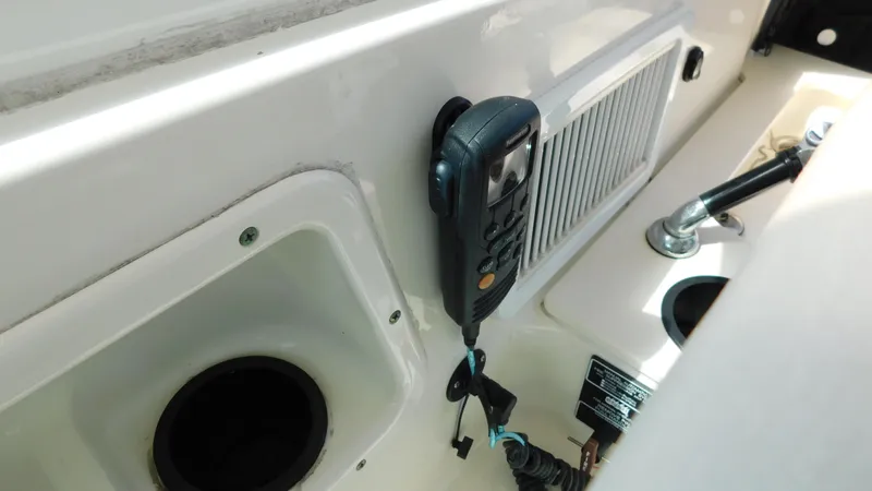  Yacht Photos Pics Interior view of a 2017 Boston Whaler 315 Conquest boat with mounted radio equipment.