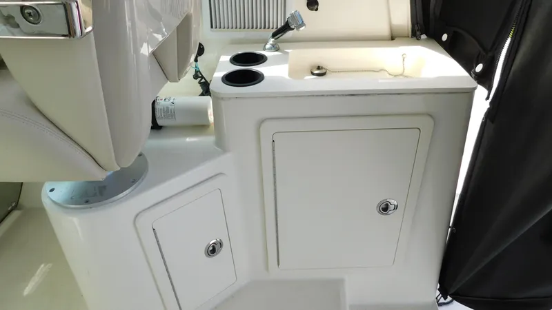  Yacht Photos Pics 2017 Boston Whaler 315 Conquest boat interior with sink and storage compartments.
