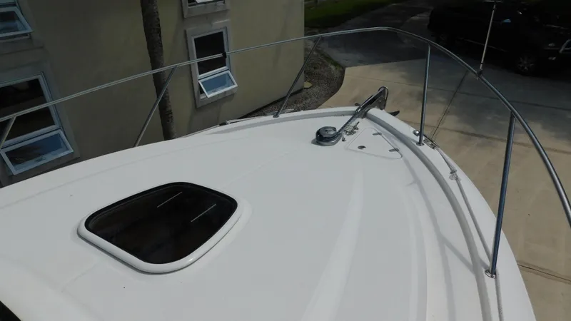  Yacht Photos Pics 2017 Boston Whaler 315 Conquest boat deck with railing and hatch.