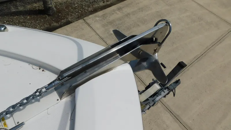  Yacht Photos Pics Bow anchor of 2017 Boston Whaler 315 Conquest boat on a concrete surface.