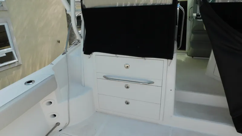  Yacht Photos Pics 2017 Boston Whaler 315 Conquest interior with storage drawers and seating area.