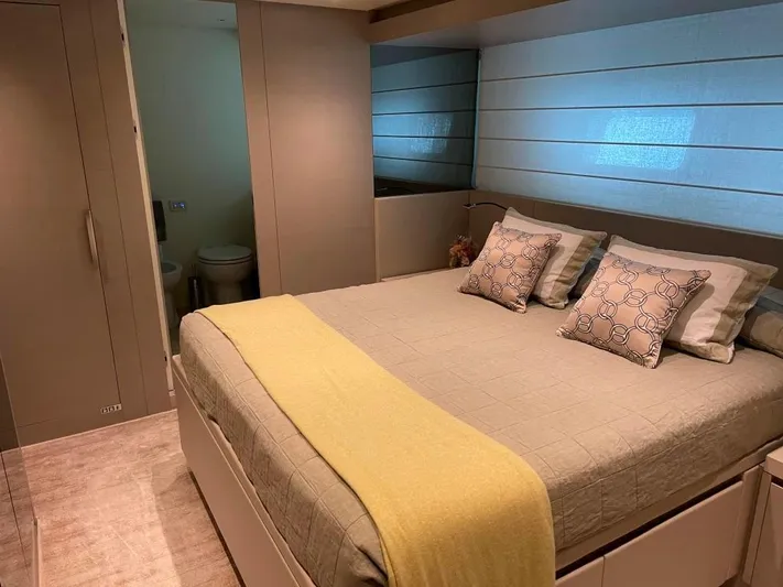  Yacht Photos Pics Luxurious bedroom on 2017 Sanlorenzo SL86 yacht with modern decor and cozy bedding.