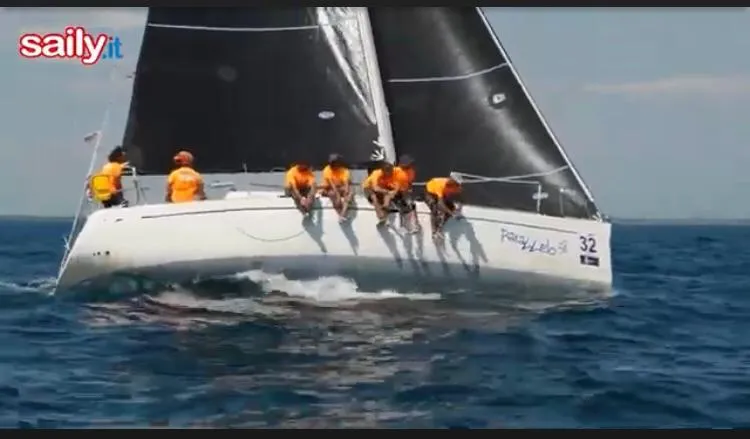  Yacht Photos Pics Sailing crew on 2004 Dufour 34 Performance yacht racing in open sea.