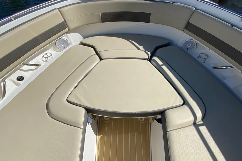 Perfect Draw Yacht Photos Pics Luxurious seating area on 2020 Pursit DC 325 boat, featuring beige cushions and speakers.