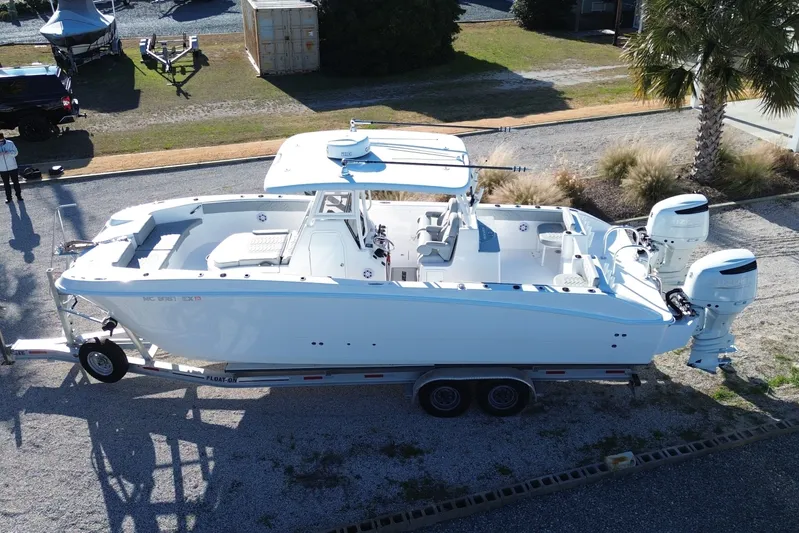  Yacht Photos Pics Aerial view of a 2022 Twin Vee 280 GFX boat on a trailer.