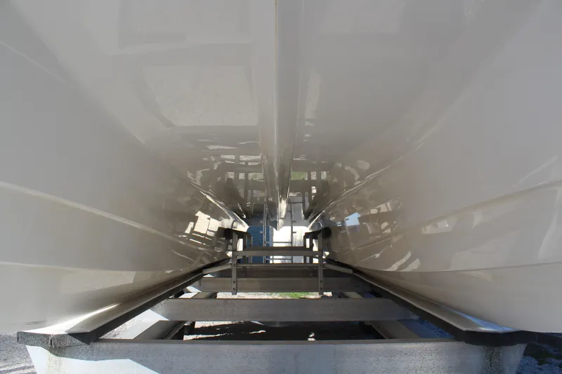  Yacht Photos Pics Underside of a 2022 Twin Vee 280 GFX boat on a trailer.