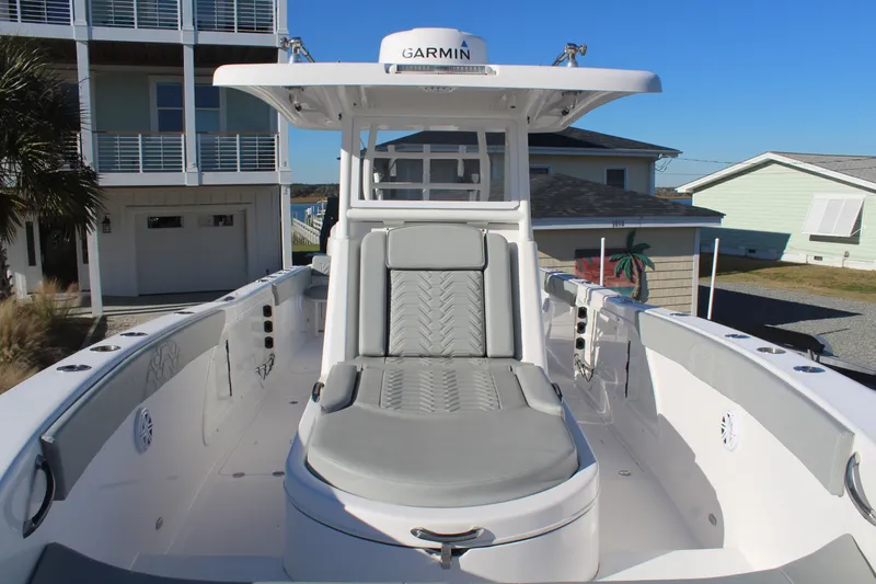  Yacht Photos Pics 2022 Twin Vee 280 GFX boat with gray seating and Garmin equipment.