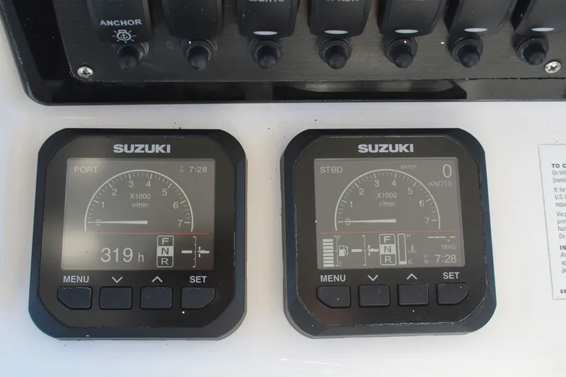  Yacht Photos Pics Suzuki engine displays on a 2022 Twin Vee 280 GFX boat.