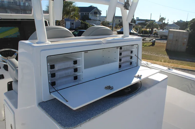  Yacht Photos Pics 2022 Twin Vee 280 GFX boat with storage and seating area.