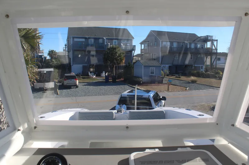  Yacht Photos Pics View from a 2022 Twin Vee 280 GFX boat onto a coastal street.