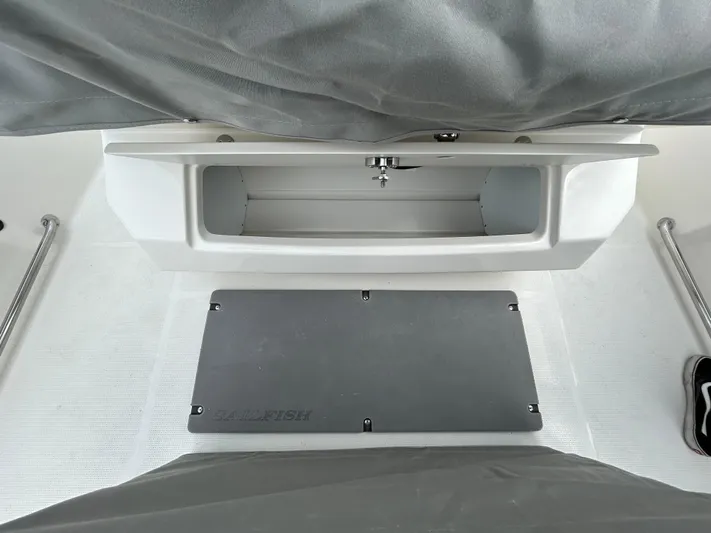 Yacht Photos Pics 2024 Sailfish 242CC boat storage compartment and deck.