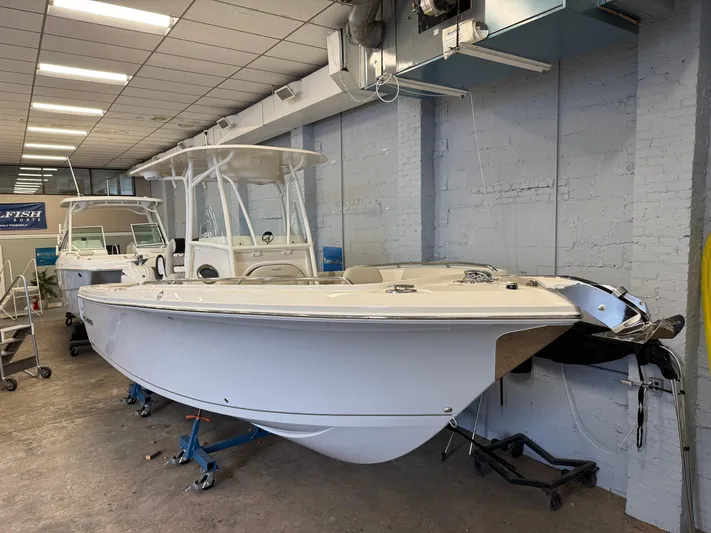  Yacht Photos Pics 2024 Sailfish 242CC boat displayed indoors on stands.