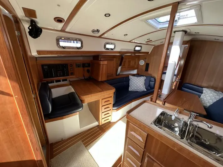 #14 Yacht Photos Pics Luxurious 2024 Tartan 395 yacht interior with wood finish and modern amenities.
