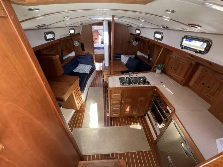 #14 Yacht Photos Pics Interior of 2024 Tartan 395 yacht with wood finish and modern amenities.