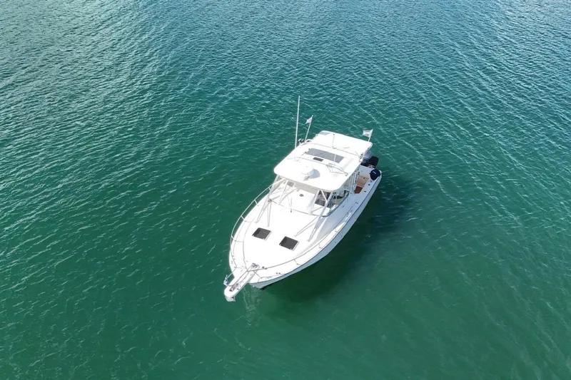  Yacht Photos Pics 2009 Grady-White Express 330 boat on calm blue water, aerial view.