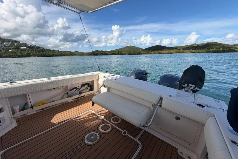  Yacht Photos Pics 2009 Grady-White Express 330 boat with scenic water and island backdrop.