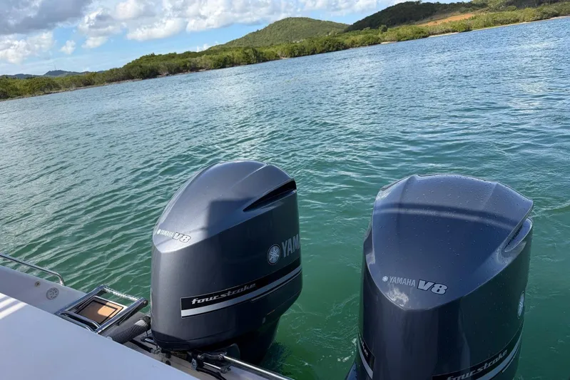  Yacht Photos Pics Twin Yamaha V8 outboard engines on a 2009 Grady-White Express 330 boat, scenic water view.