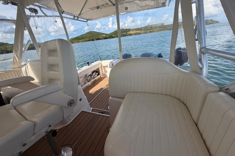  Yacht Photos Pics 2009 Grady-White Express 330 boat interior with white seating and scenic water view.