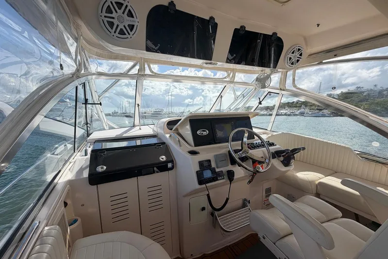  Yacht Photos Pics 2009 Grady-White Express 330 boat interior with steering wheel and navigation equipment.