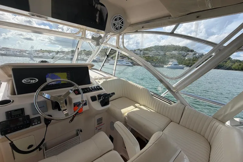  Yacht Photos Pics 2009 Grady-White Express 330 boat interior with helm, seating, and ocean view.