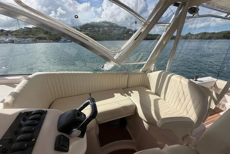  Yacht Photos Pics 2009 Grady-White Express 330 boat interior with plush seating and scenic water view.