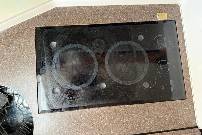  Yacht Photos Pics Built-in stovetop on 2009 Grady-White Express 330 boat, featuring dual burners.