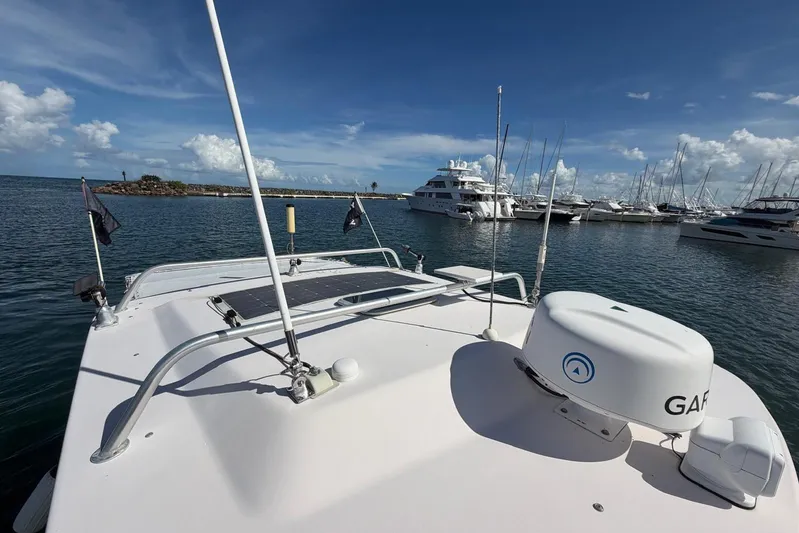 Yacht Photos Pics 2009 Grady-White Express 330 boat docked in marina, clear sky, calm water.