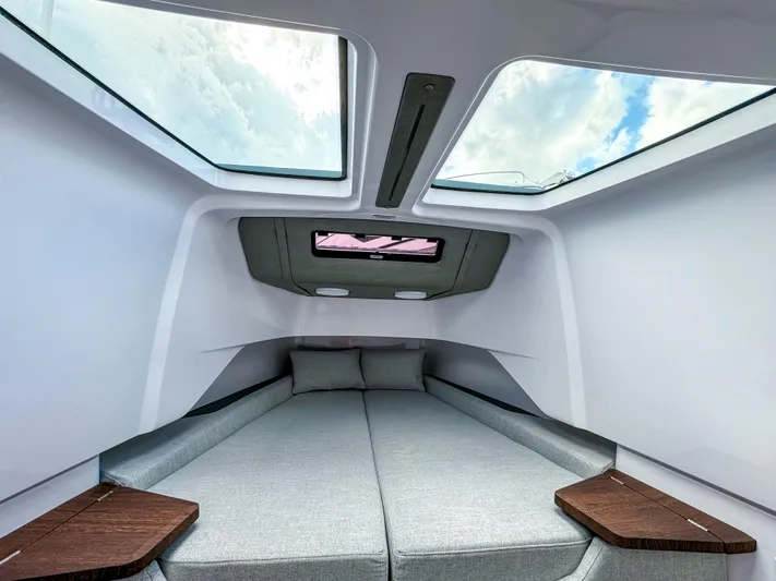  Yacht Photos Pics 2024 Axopar 37XC CROSS CABIN interior with skylights and modern bedding.