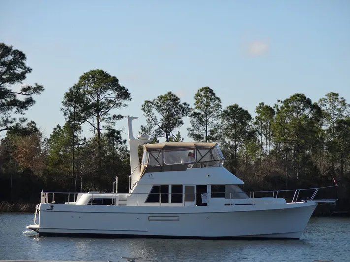 Slow Dance 1000 Hr. Service & Ready To Go Again Yacht Photos Pics 2006 Ocean Alexander 48 Classico yacht on calm water.