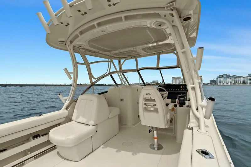 Patsy Ru Yacht Photos Pics 2016 Grady-White 285 Freedom boat interior with seating and helm, on calm water.