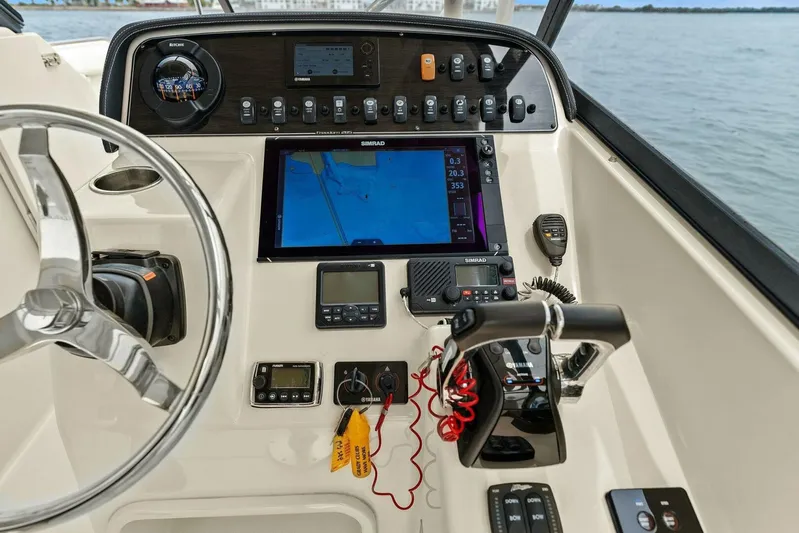 Patsy Ru Yacht Photos Pics Control panel of 2016 Grady-White 285 Freedom boat with navigation and communication equipment.